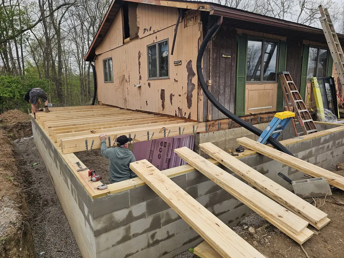 KNU Services building the floor system for a home addition