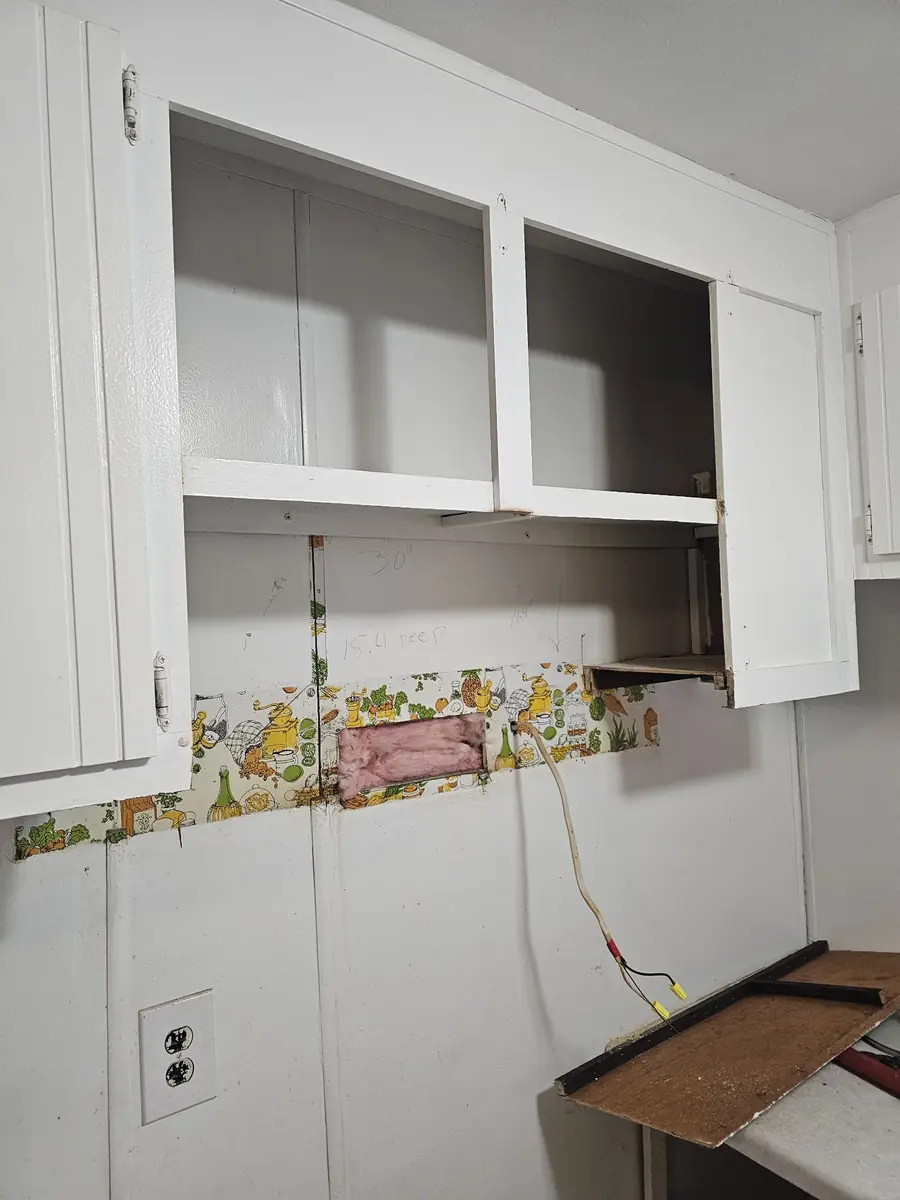 Kitchen cabinet removal during a residential remodeling project