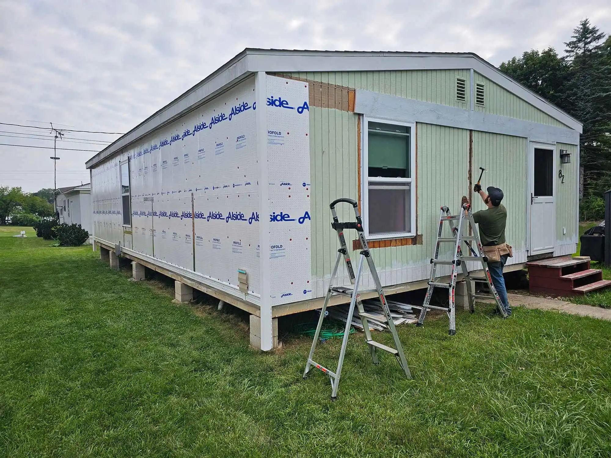 KNU Services professional completing exterior home improvements